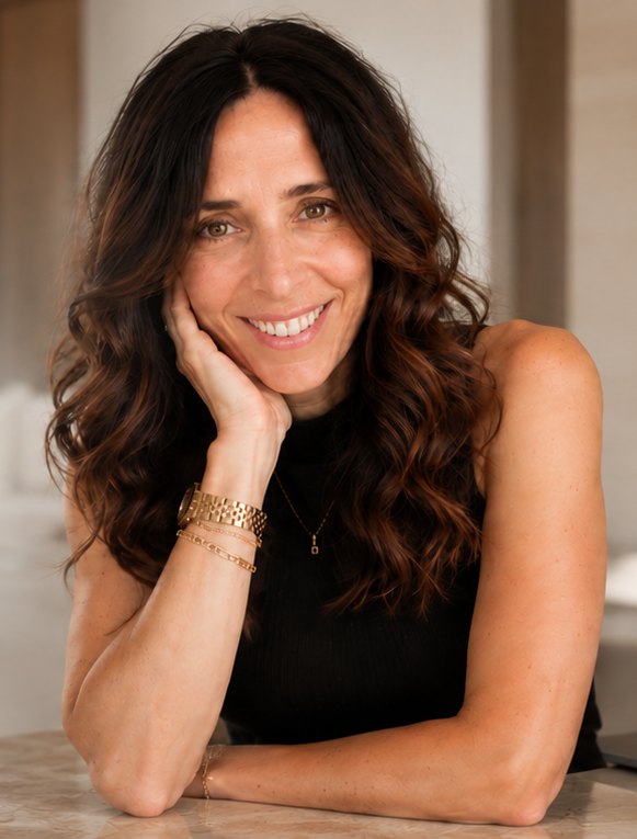 Tanya Ganian smiling, resting her chin on her hand